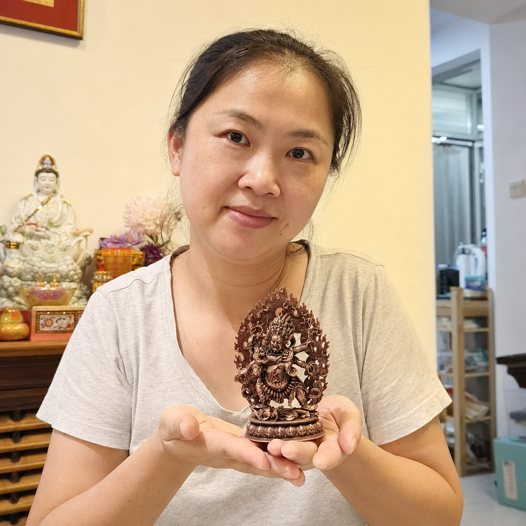 Six-Armed Mahakala Copper Statue for Protection and Courage – 12 cm held in a Malaysian home