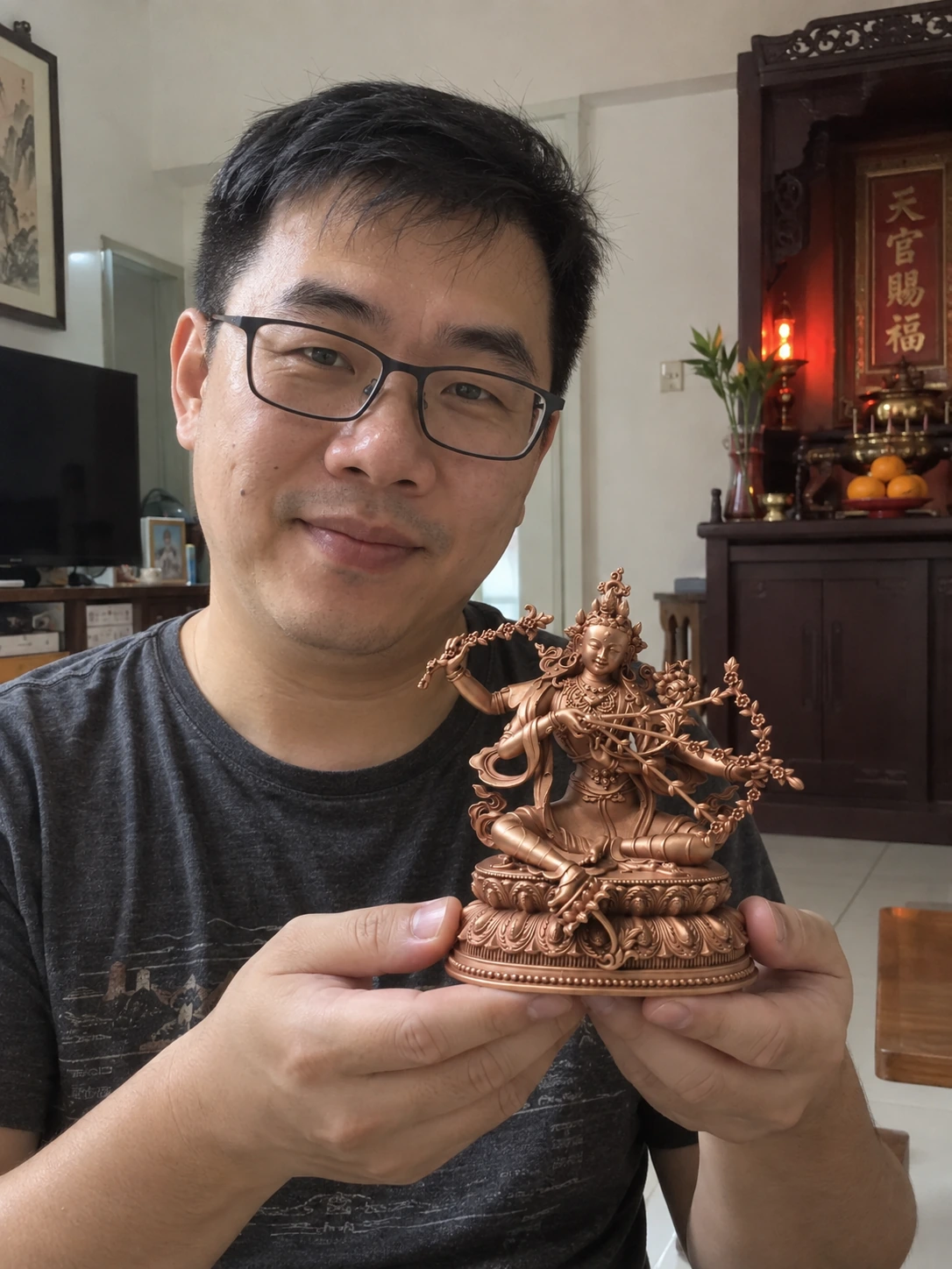 Kurukulle (Red Tara) statue held in a Malaysian home