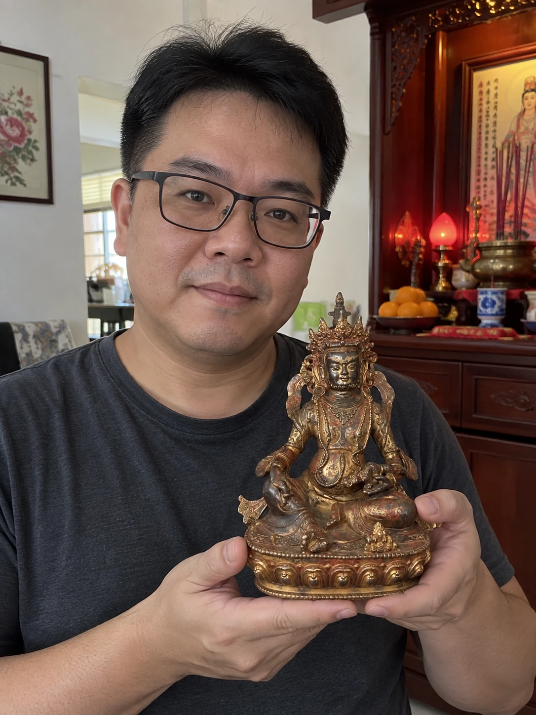 Vajrasattva statue held in a Malaysian home