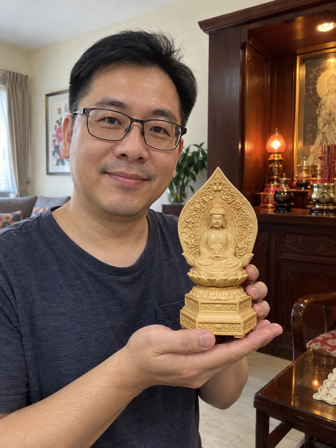 Hand-Carved Boxwood Amitabha Buddha Statue – Peace and Compassion 15.5 cm held in a Malaysian home